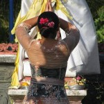 Balinese woman praying at temple