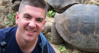 Matt Long of Landlopers with tortoise in Galapagos