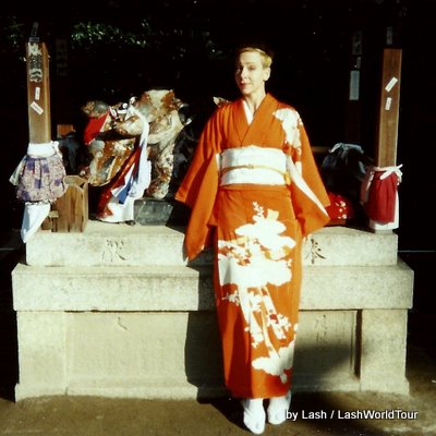 Lash in orange kimono at Kitano Tenmangu Shrine, Kyoto, Japan