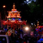 Thaipusam's silver chariot illuminated at night